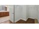Walk-in closet featuring hardwood floors, wire shelving and access to the main bathroom at 960 Pickering Path, The Villages, FL 32163