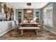 Inviting dining room featuring a rustic wood table, accent wall, and ample seating at 9605 Lynwood St, Clermont, FL 34711