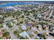 The aerial view shows this home nestled in a vibrant community with nearby amenities and lake access at 998 Sayle St, The Villages, FL 32162