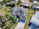 Aerial view of the property featuring lush landscaping and a well-maintained yard at 998 Sayle St, The Villages, FL 32162