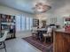 Well-lit bedroom with shutters, a small table, and vintage-inspired furnishings at 998 Sayle St, The Villages, FL 32162