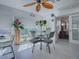 Bright dining area with large windows providing a scenic view and stylish table set at 998 Sayle St, The Villages, FL 32162