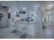 Bright open kitchen with barstool seating and stainless steel appliances at 998 Sayle St, The Villages, FL 32162