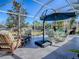 Screened-in patio with a variety of outdoor seating options for relaxing and entertaining guests at 998 Sayle St, The Villages, FL 32162
