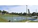 The tennis court is fenced-in with a covered structure for relaxing between sets at 10301 Us Highway 27 # 39, Clermont, FL 34711