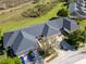 Beautiful aerial view of the home showcasing its well-maintained landscaping and charming neighborhood setting at 1037 Green Gate Blvd, Groveland, FL 34736