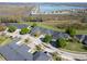 Aerial shot showing homes with a community dock, close to tranquil water, and beautiful surroundings at 1037 Green Gate Blvd, Groveland, FL 34736