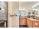 Bathroom showcasing a double vanity with granite counters and a separate shower area at 1037 Green Gate Blvd, Groveland, FL 34736