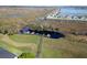 Aerial view of boat dock with boats in the water at 1037 Green Gate Blvd, Groveland, FL 34736