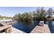 Community boat dock and pier on a sunny day with waterfront views at 1037 Green Gate Blvd, Groveland, FL 34736