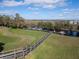 Scenic view of the wooden community dock providing access to the beautiful river and surrounding wetlands at 1037 Green Gate Blvd, Groveland, FL 34736