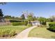 Inviting community pool area with manicured landscaping and clear blue skies at 1037 Green Gate Blvd, Groveland, FL 34736