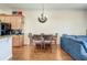 Cozy dining area featuring hardwood floors and a stylish chandelier at 1037 Green Gate Blvd, Groveland, FL 34736