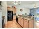 Spacious kitchen island with granite countertops overlooking the living area at 1037 Green Gate Blvd, Groveland, FL 34736