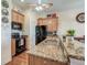 Open kitchen featuring granite countertops and views of the combined living space at 1037 Green Gate Blvd, Groveland, FL 34736