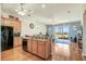 Kitchen featuring granite countertops, stainless appliances, and views to living area at 1037 Green Gate Blvd, Groveland, FL 34736