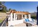 Pool house with white pillars and lounge chairs for community members at 1037 Green Gate Blvd, Groveland, FL 34736