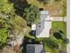 Aerial view of the home showcases its roof, yard, and neighborhood at 1041 Eastbrook Ave, Deltona, FL 32738