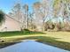 Green backyard with patio, perfect for outdoor activities and enjoying the natural surroundings at 1041 Eastbrook Ave, Deltona, FL 32738