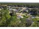 Aerial view of the neighborhood showcases tree coverage and surrounding streets at 1041 Eastbrook Ave, Deltona, FL 32738