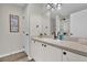 Bathroom with a single-sink vanity and walk-in shower at 1106 Blythe Way, The Villages, FL 32162