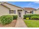 Inviting home with beautiful landscaping and a charming front entrance at 1106 Blythe Way, The Villages, FL 32162