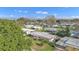 An aerial view of a mobile home neighborhood with many mature trees at 1112 Forest Ln, Tavares, FL 32778