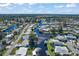 Stunning aerial view of waterfront homes with private boat docks nestled along canals and waterways at 1112 Forest Ln, Tavares, FL 32778