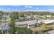 An aerial view of a mobile home neighborhood with mature trees at 1112 Forest Ln, Tavares, FL 32778