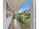 Charming outdoor porch and lush tropical landscaping at 1112 Forest Ln, Tavares, FL 32778
