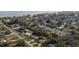 An aerial view highlights the lot's location within a quiet neighborhood near a scenic lake and waterfront at 119 E Croton Way, Howey In The Hills, FL 34737