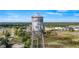 Panoramic aerial view of the Howey in the Hills Water Tower, overlooking the lush landscape at 119 E Croton Way, Howey In The Hills, FL 34737