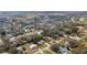 Expansive aerial view of the residential neighborhood showcasing tree-lined streets and manicured lawns at 119 E Croton Way, Howey In The Hills, FL 34737