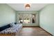 Sunlit bedroom featuring a daybed with built-in storage and large windows offering outdoor views at 119 E Croton Way, Howey In The Hills, FL 34737