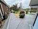 A view of the back patio, trees, pond, and a view of the neighbor's yard at 12066 Se 60Th Avenue Rd, Belleview, FL 34420