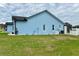 Picture of a light blue house with white trim on a green lawn at 12066 Se 60Th Avenue Rd, Belleview, FL 34420