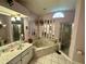 This bright primary bathroom includes a garden tub and a separate shower at 12066 Se 60Th Avenue Rd, Belleview, FL 34420