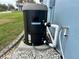 Outdoor Hayward heat pump, resting on a concrete pad with rock surround at 12066 Se 60Th Avenue Rd, Belleview, FL 34420