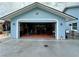 Large garage space with an open overhead door at 12066 Se 60Th Avenue Rd, Belleview, FL 34420