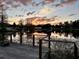 Sunset view from a dock with a charming waterfront setting at 12066 Se 60Th Avenue Rd, Belleview, FL 34420