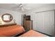 Comfortable bedroom features twin beds, ceiling fan, and plenty of storage at 1209 Barcelona Dr, The Villages, FL 32159