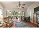 Relaxing living room featuring tile floors and views to the outdoor space at 1209 Barcelona Dr, The Villages, FL 32159