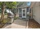 Outdoor patio area featuring a grill and access to a screened-in sunroom at 1209 Barcelona Dr, The Villages, FL 32159