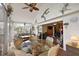 Bright sunroom with glass table and dining area, leading to a cozy living space at 1209 Barcelona Dr, The Villages, FL 32159