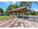 Waterfront property featuring a private boat dock with a covered slip and a picnic area at 12221 Helena Ct, Leesburg, FL 34788