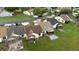 Aerial view of backyards with patios and a community neighborhood, featuring a serene lake at 123 Dresdan Ct, Sanford, FL 32771