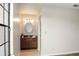 Bathroom with wood vanity, granite countertop, and a well-lit mirror at 123 Dresdan Ct, Sanford, FL 32771