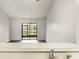 Open living room featuring sliding glass doors and dark wood-look flooring at 123 Dresdan Ct, Sanford, FL 32771