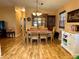 Inviting dining area with wooden table and chairs, adjacent to hutch at 1234 E Schwartz Blvd, Lady Lake, FL 32159