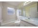 Bathroom featuring a tub and shower, toilet, and vanity with sink at 13219 Meadowlark Ln, Orlando, FL 32828